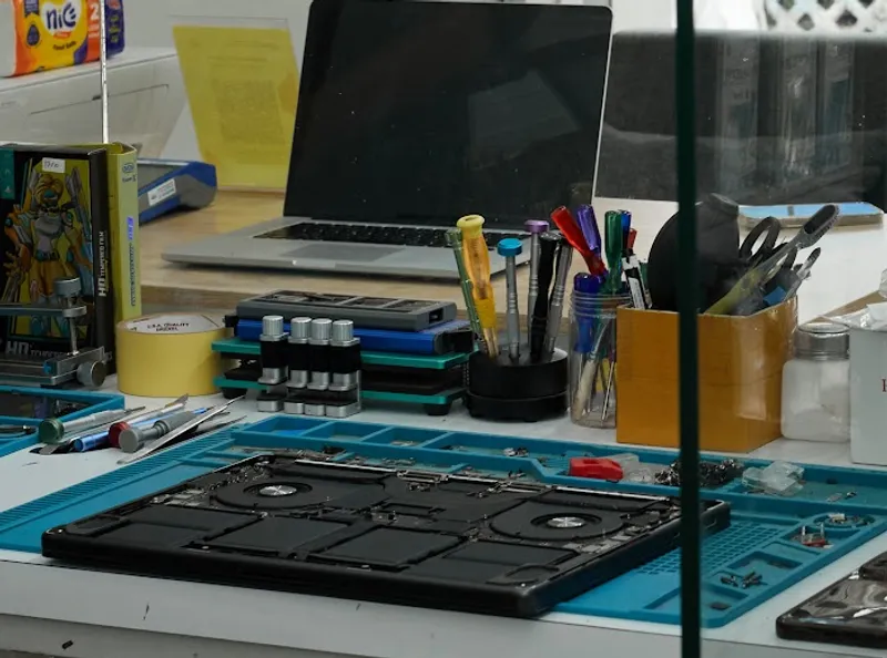 Repair workbench with tools visible from the street at FixBox Canggu
